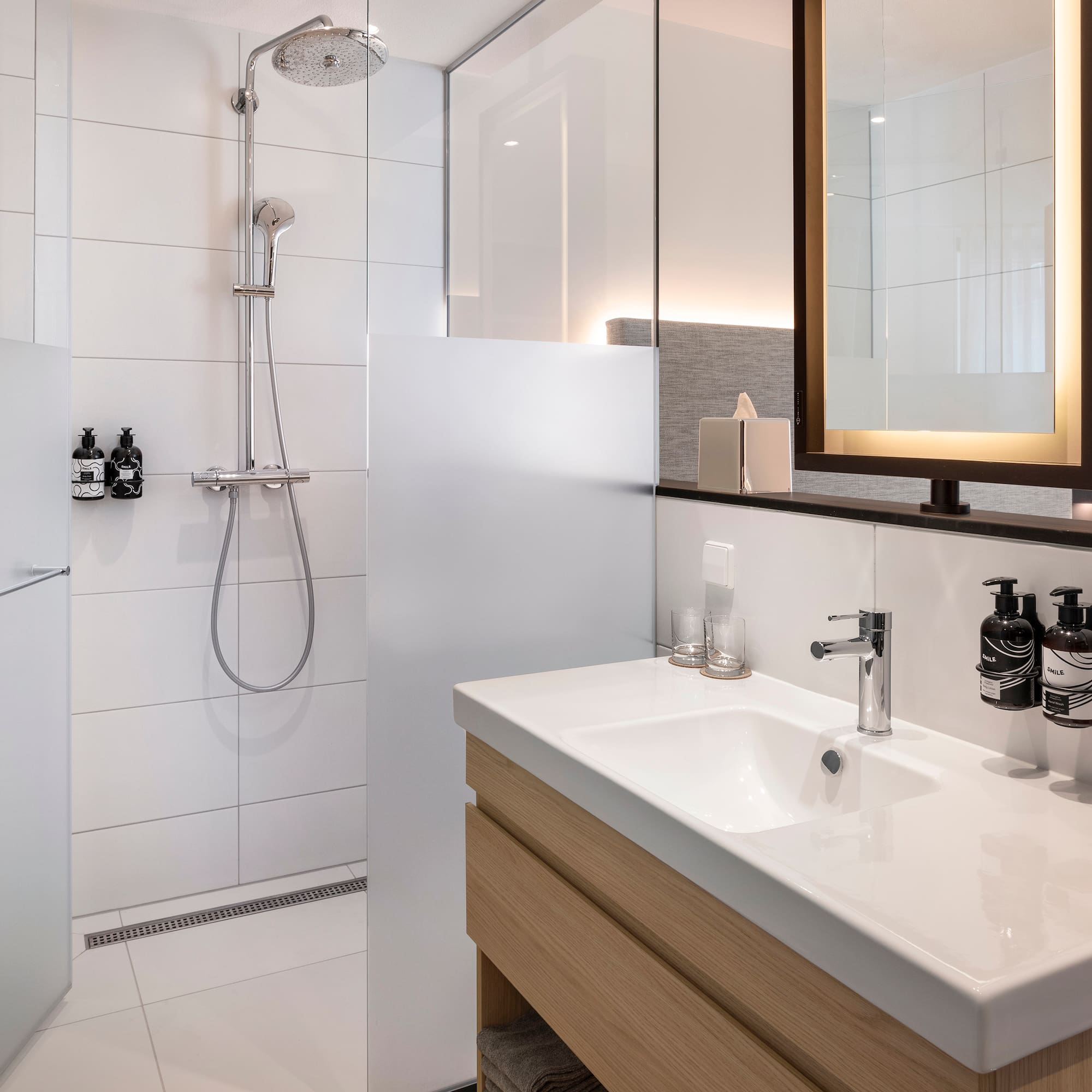 a bathroom with a shower and sink