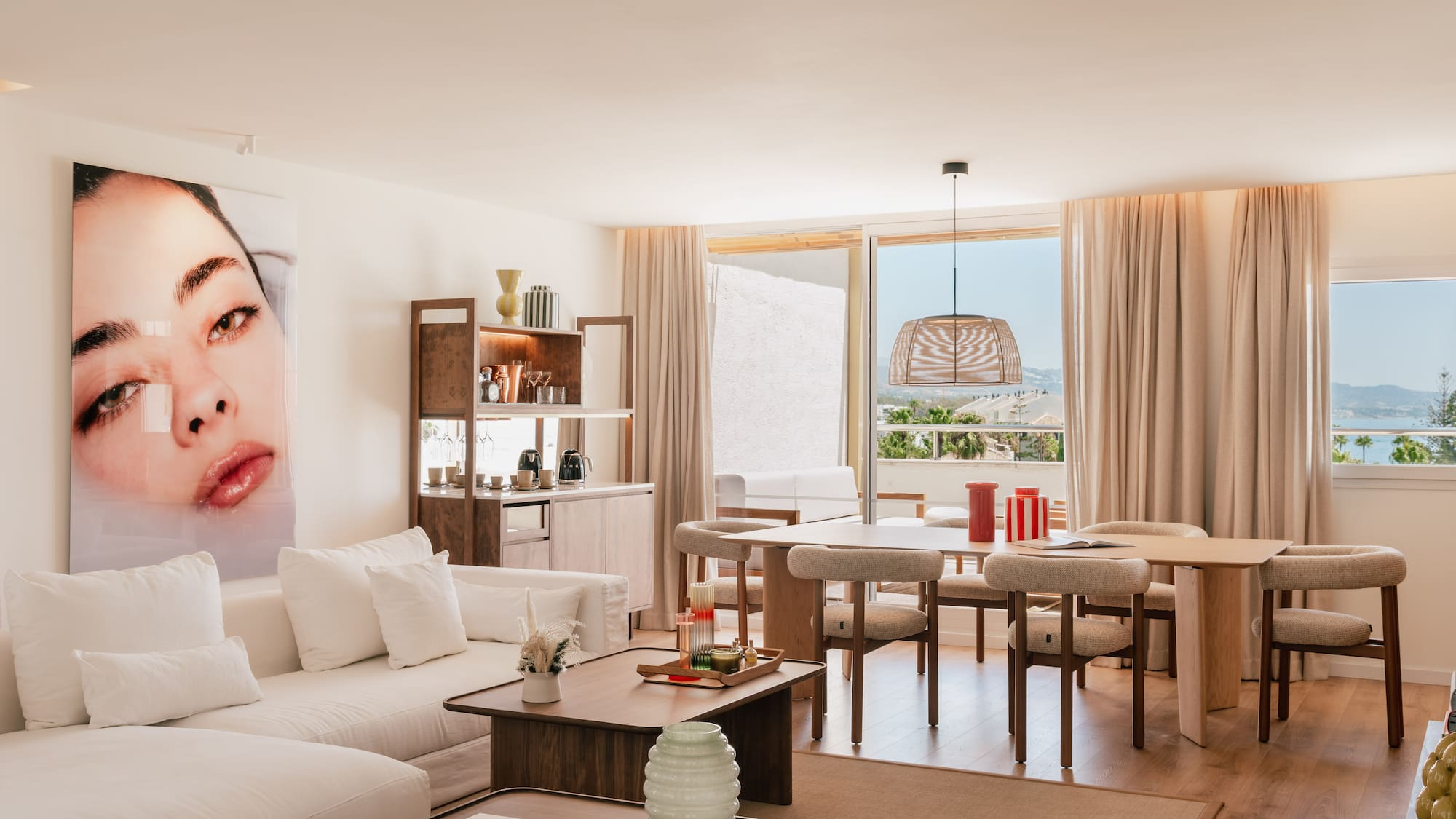 a living room with a table and chairs