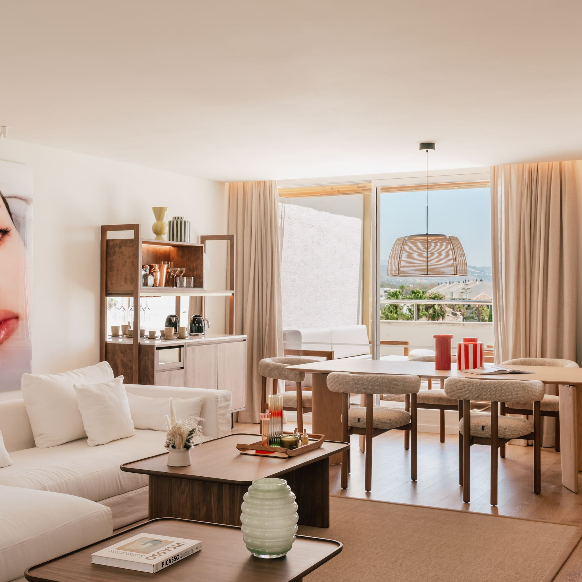 a living room with a table and chairs