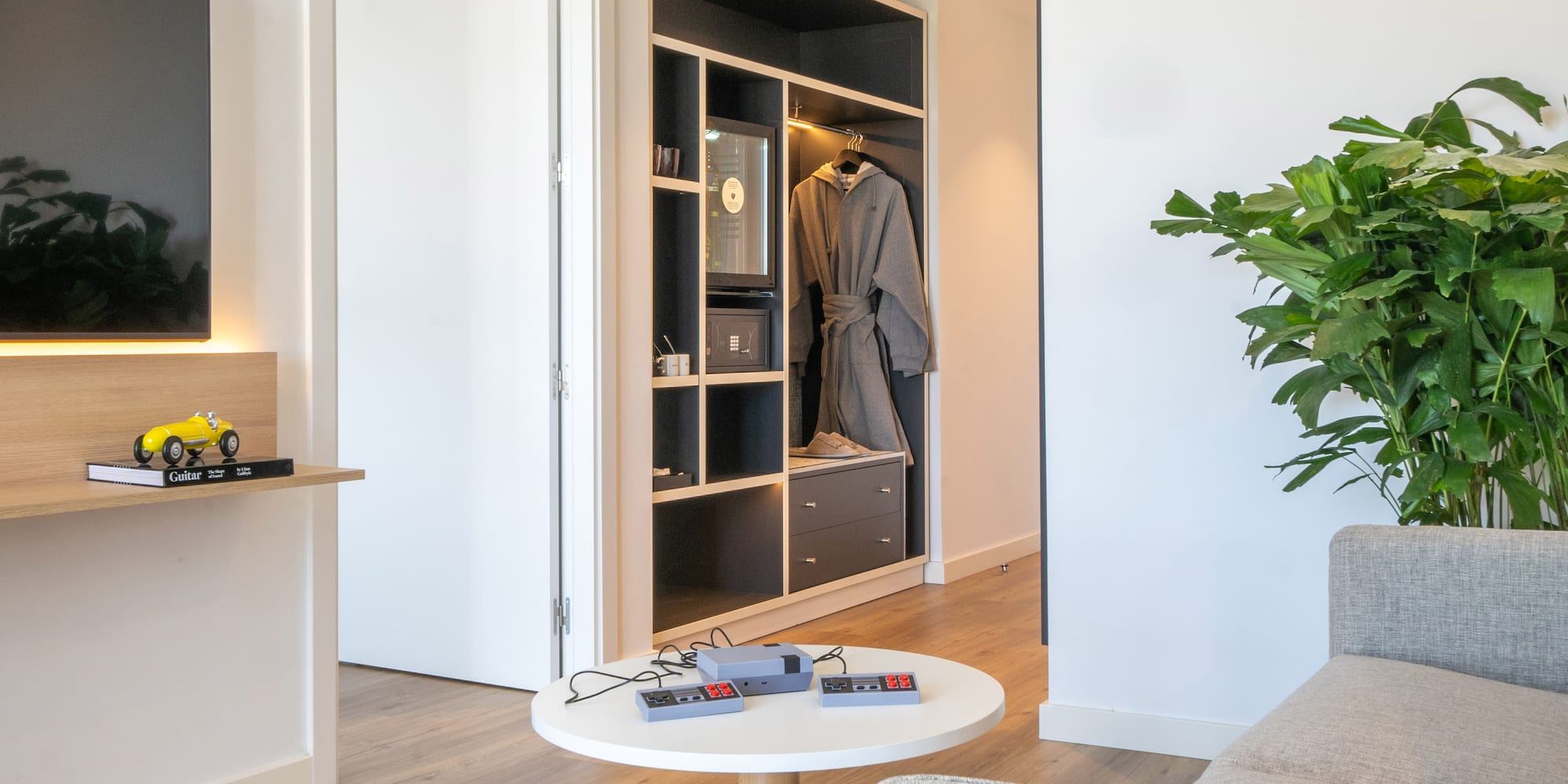 a room with a white couch and a white table
