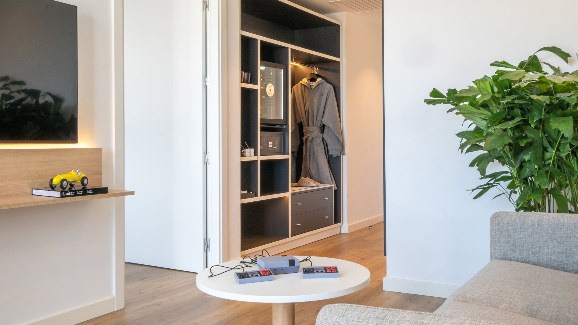 a room with a white couch and a white table