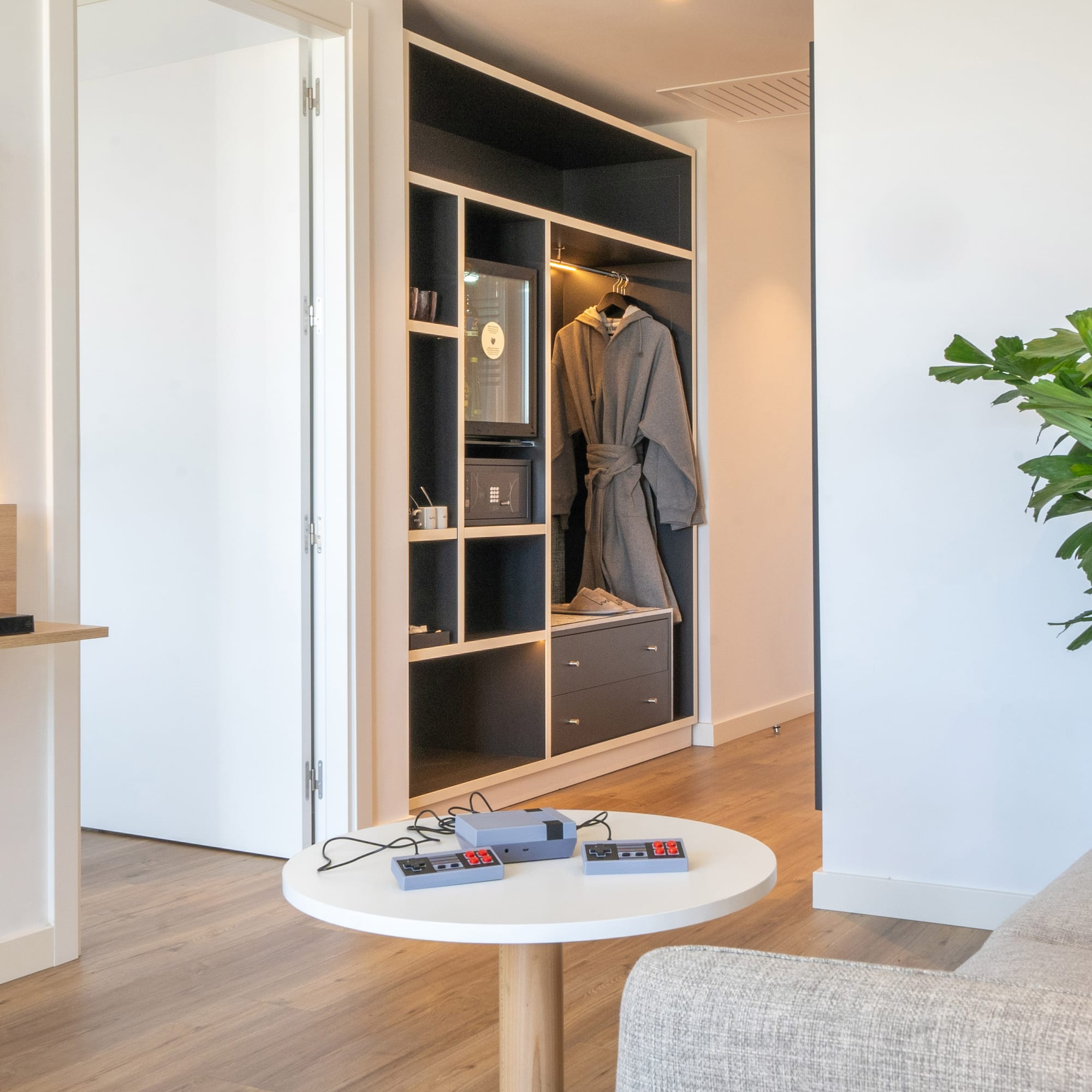 a room with a white couch and a white table