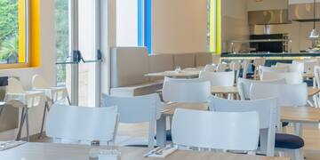 a room with tables and chairs