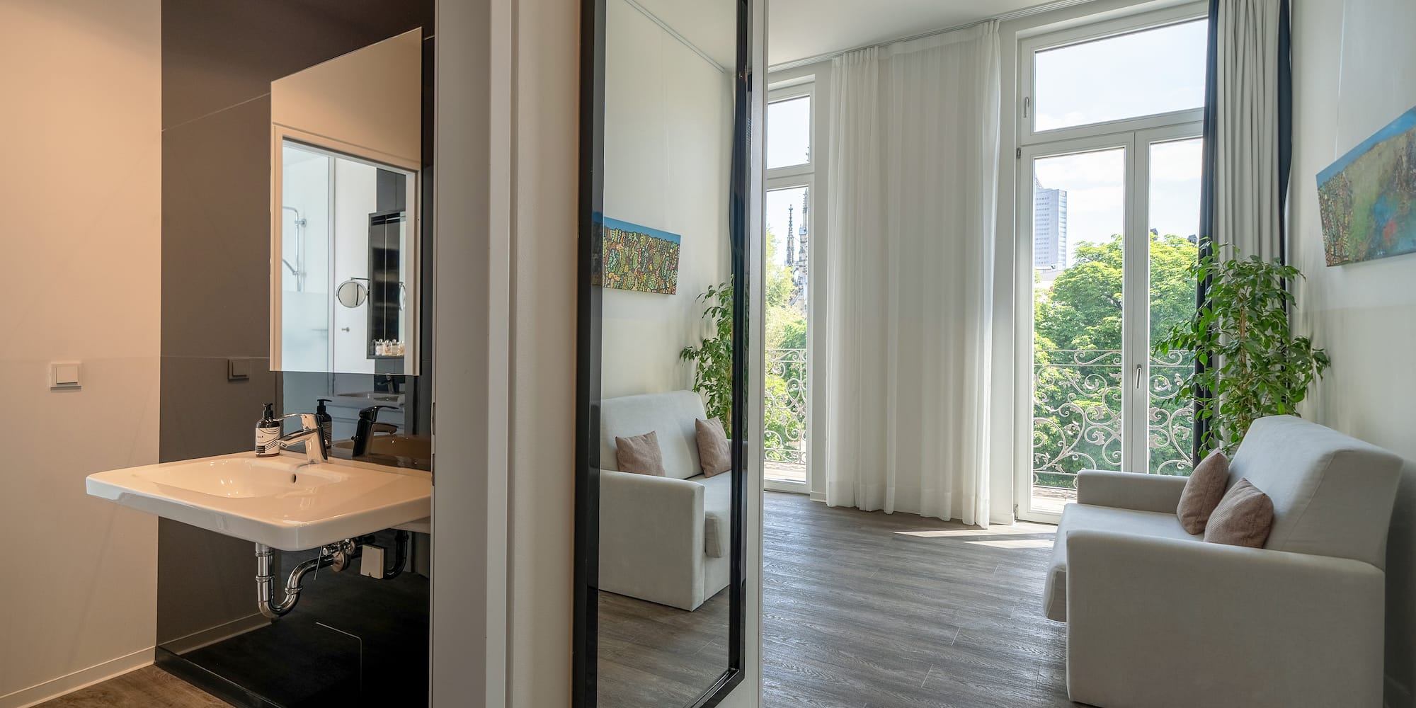 a room with a mirror and a couch