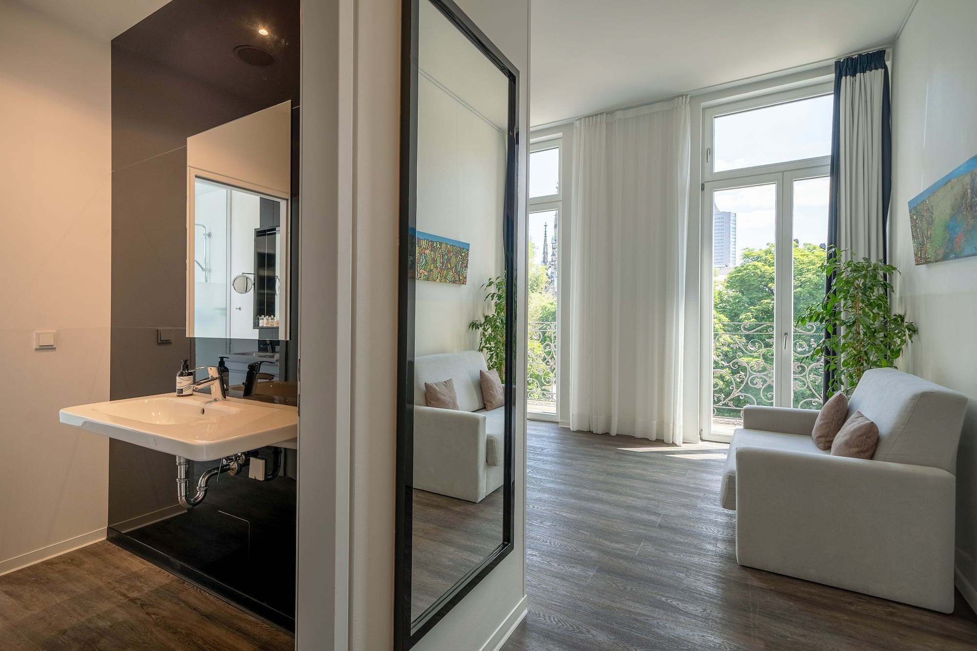 a room with a mirror and a couch