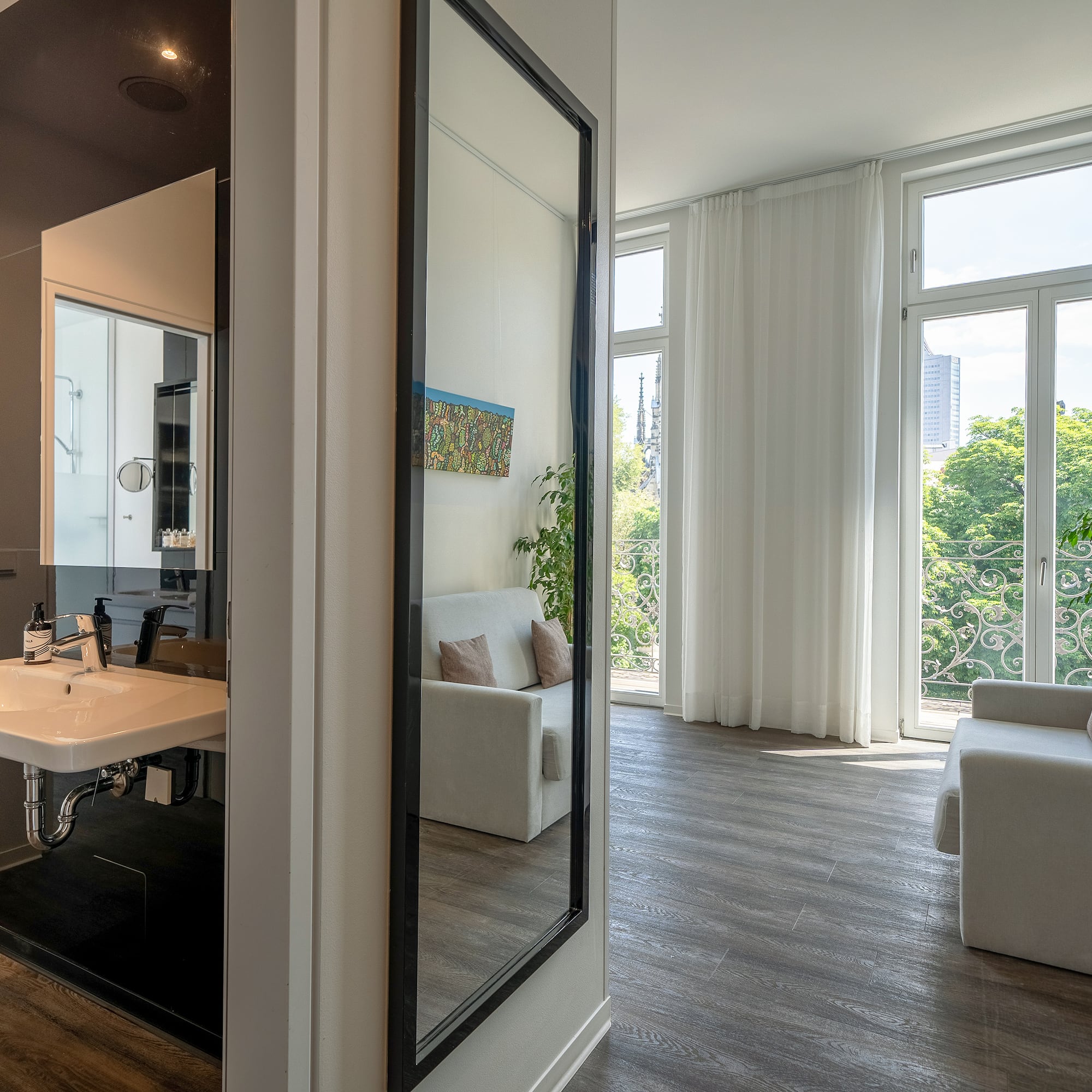 a room with a mirror and a couch