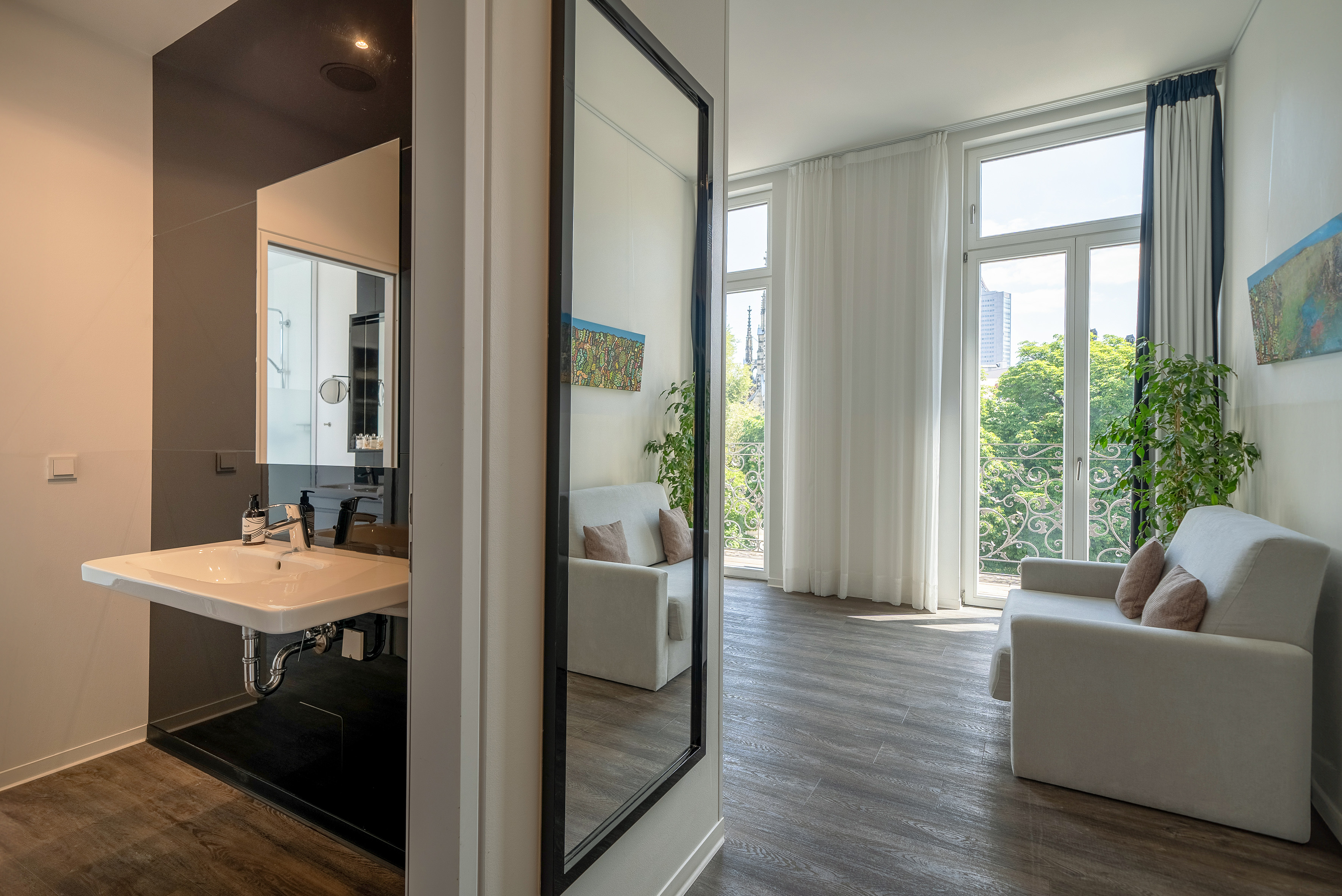 a room with a mirror and a couch