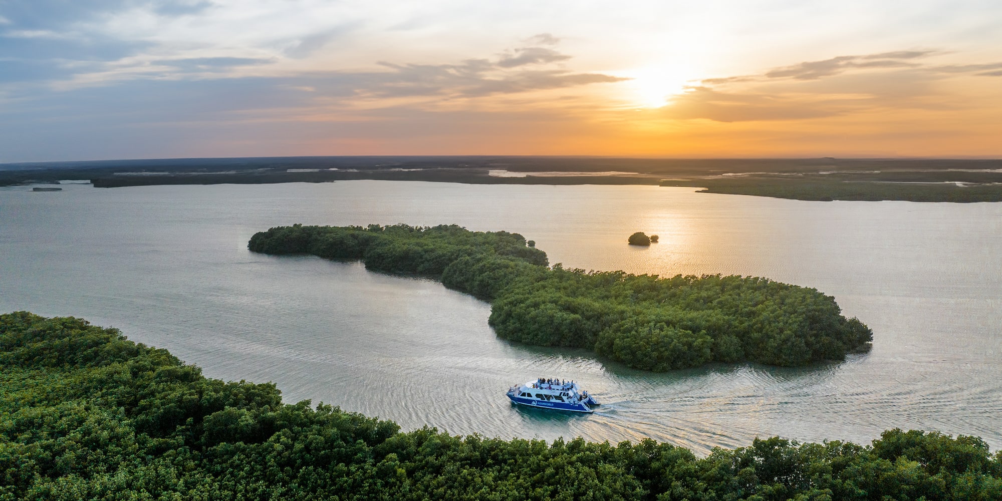 a boat on water with trees around it
