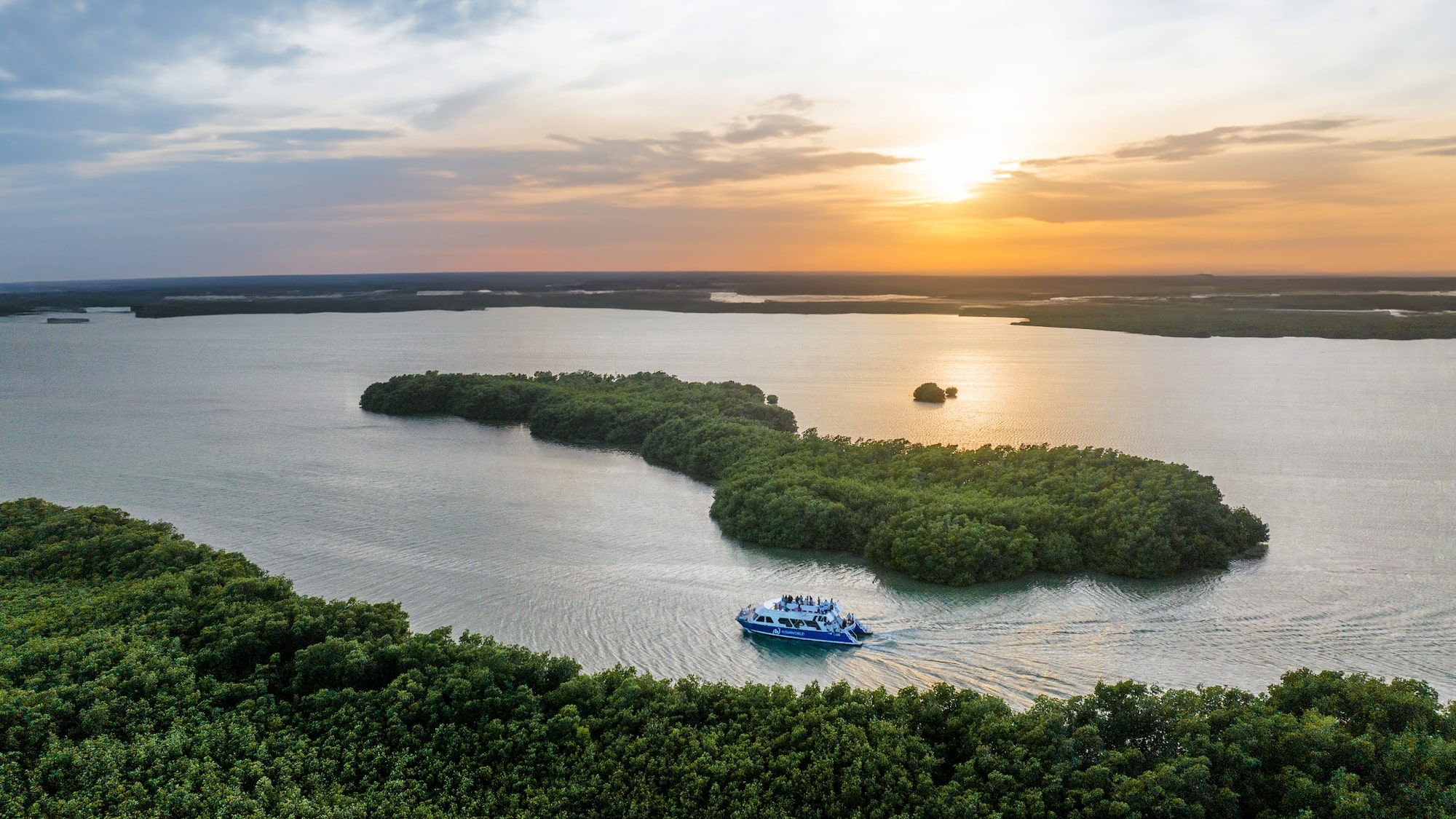 a boat on water with trees around it