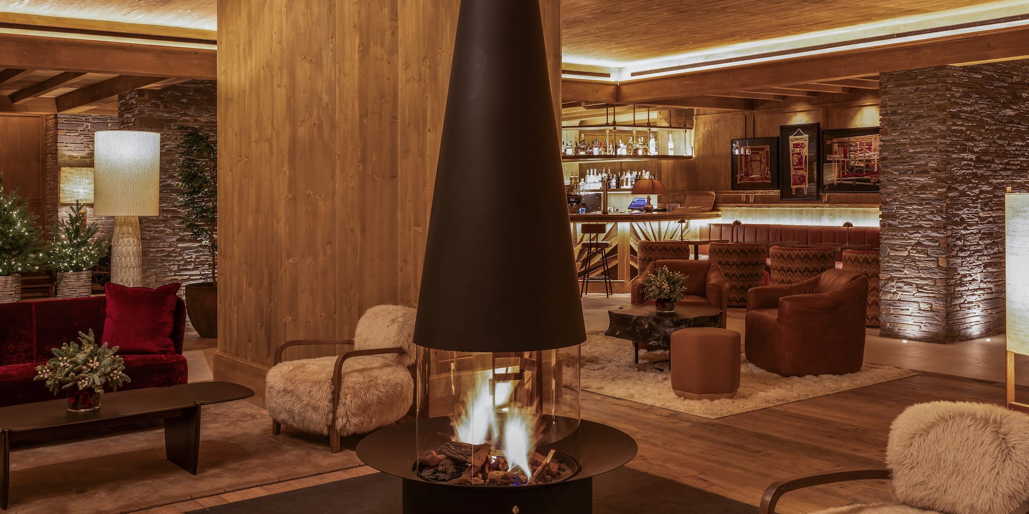 a room with a fireplace and chairs