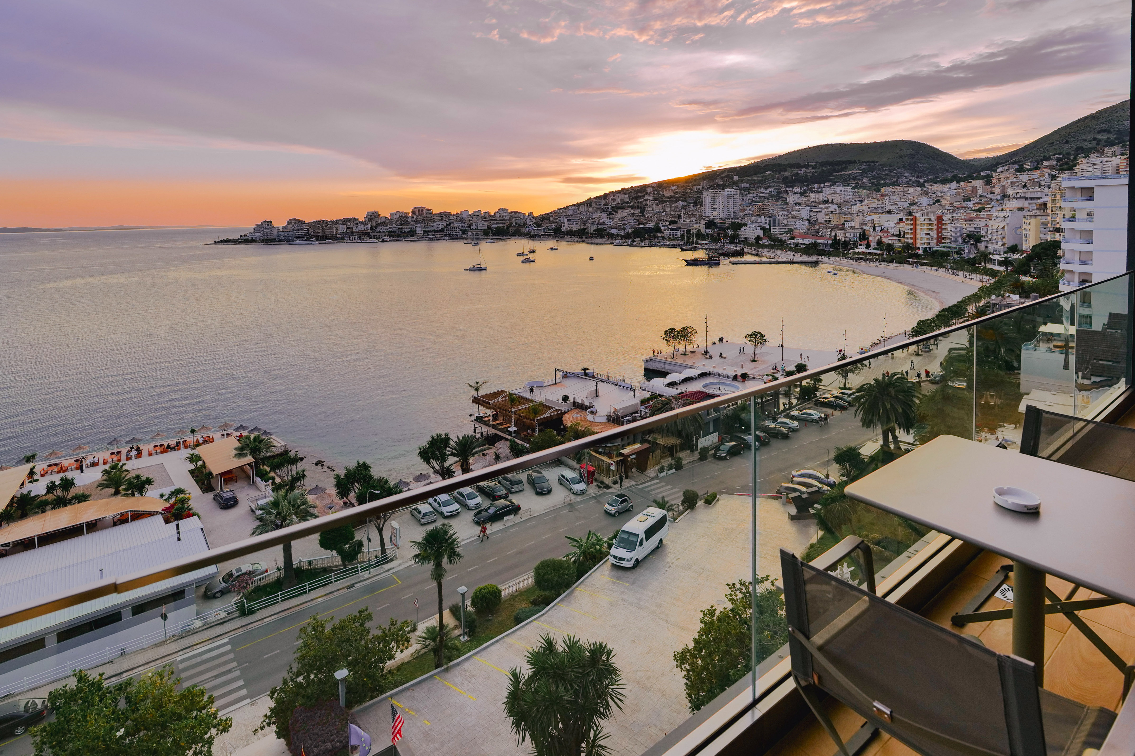 a view of a city and a body of water from a balcony