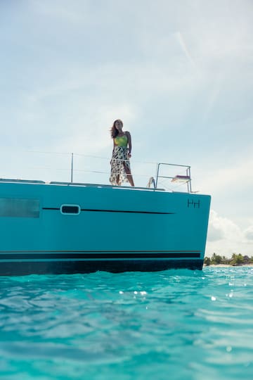 a woman standing on a boat