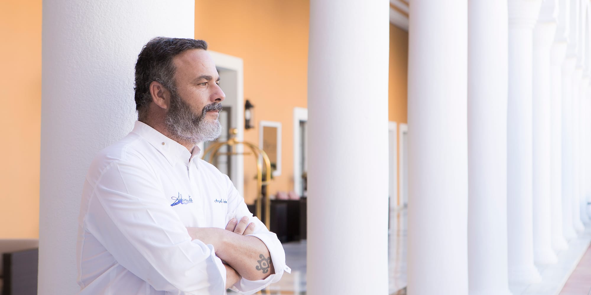 a man standing with his arms crossed