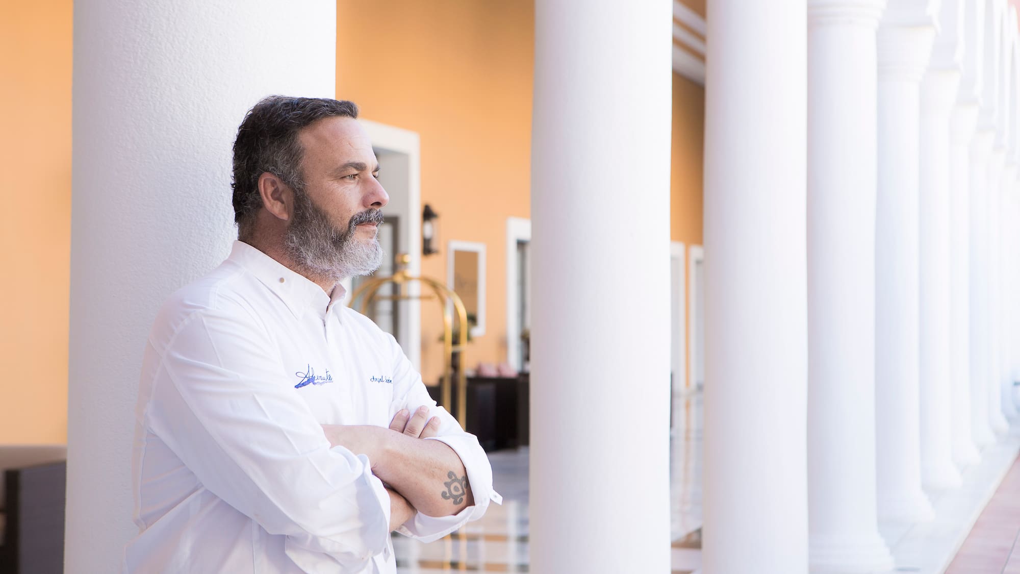 a man standing with his arms crossed