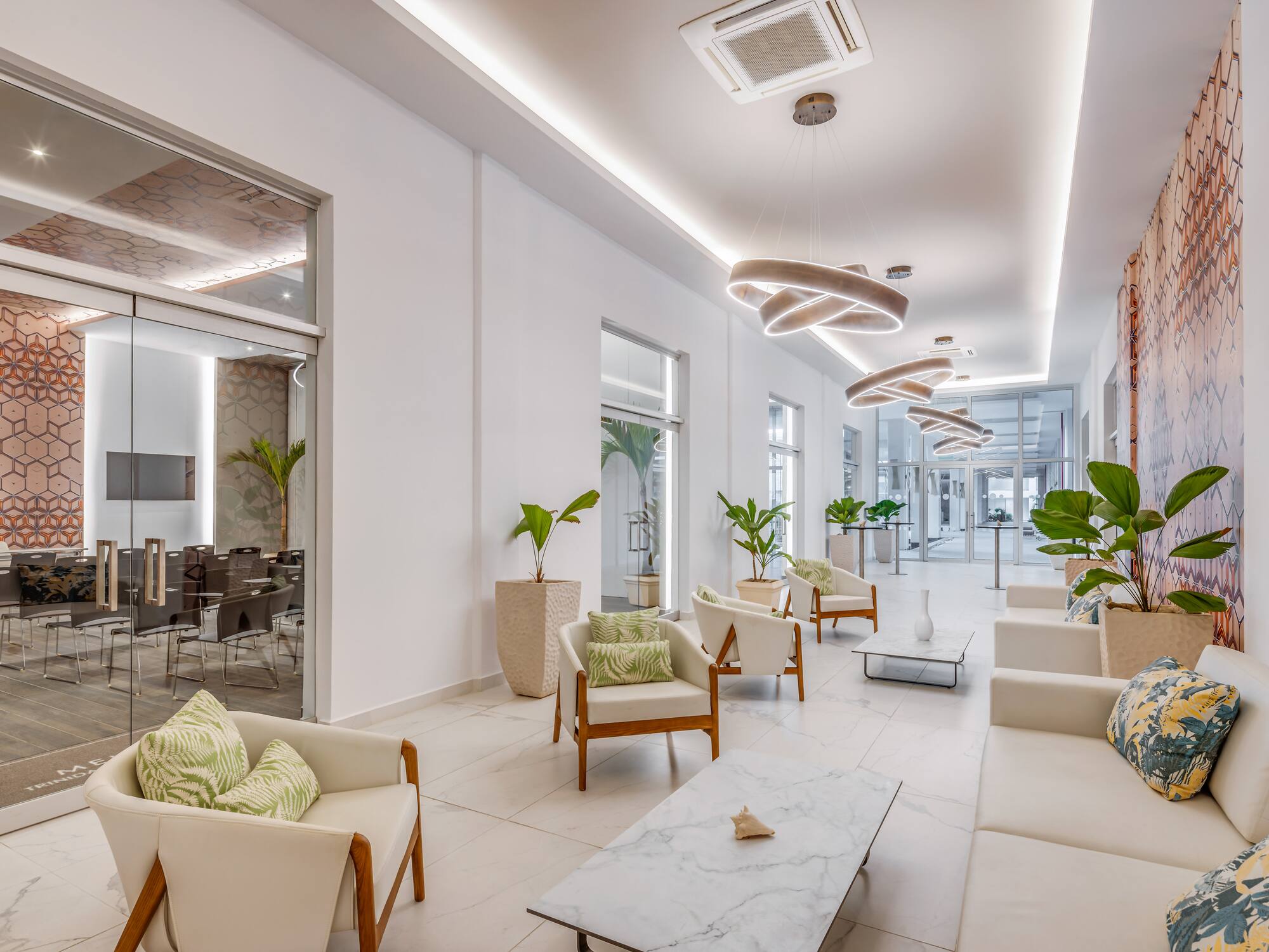 a room with white furniture and chairs