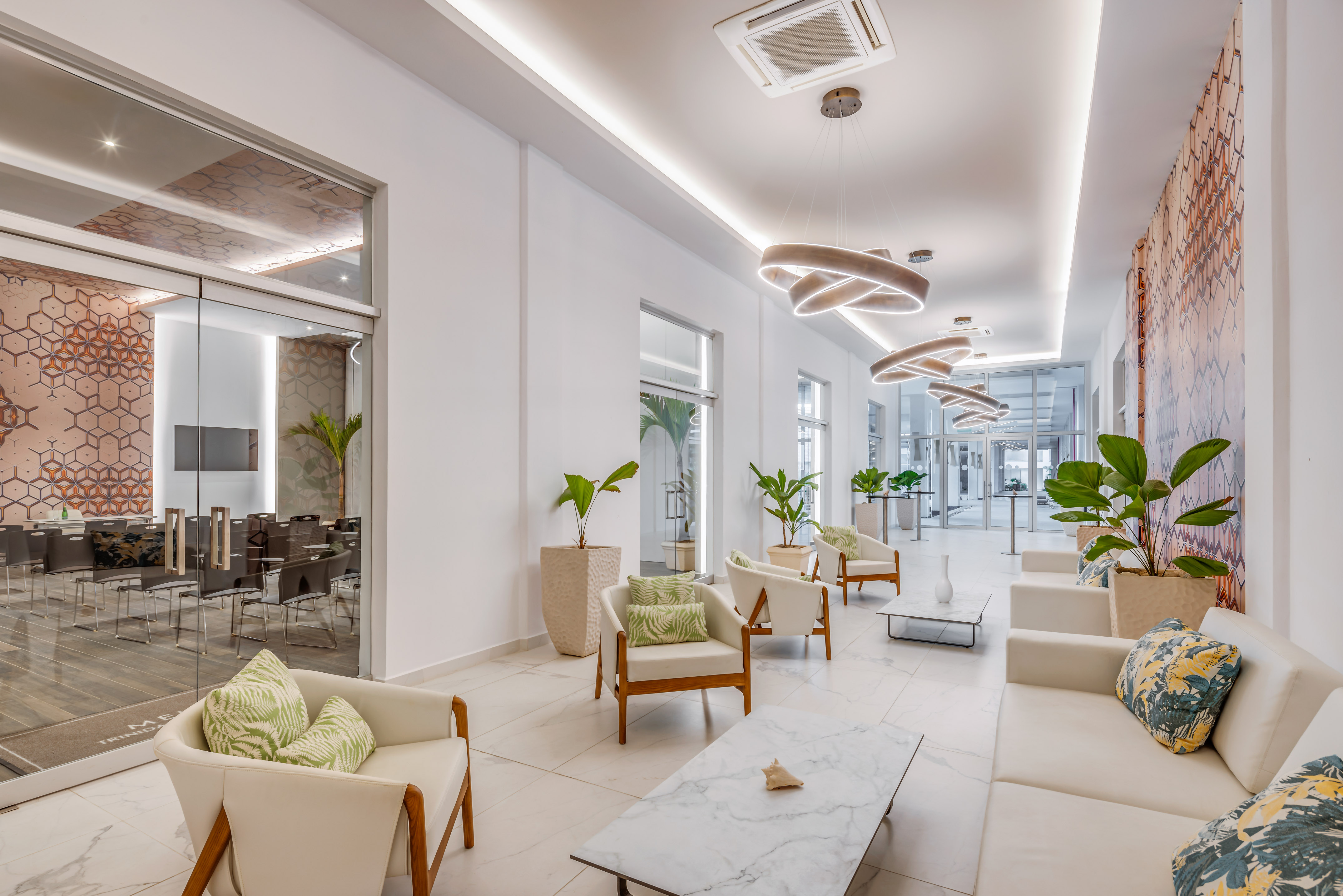 a room with white furniture and chairs