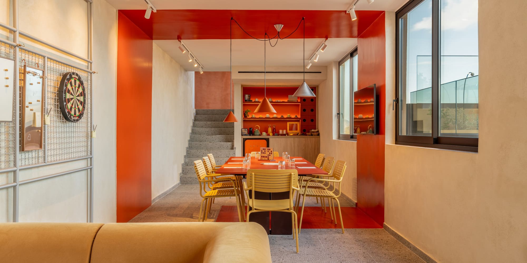 a dining room with a table and chairs
