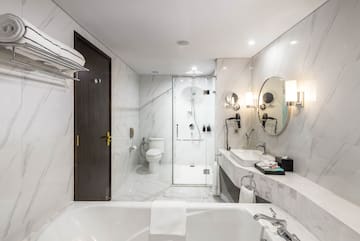 a bathroom with a tub and sink