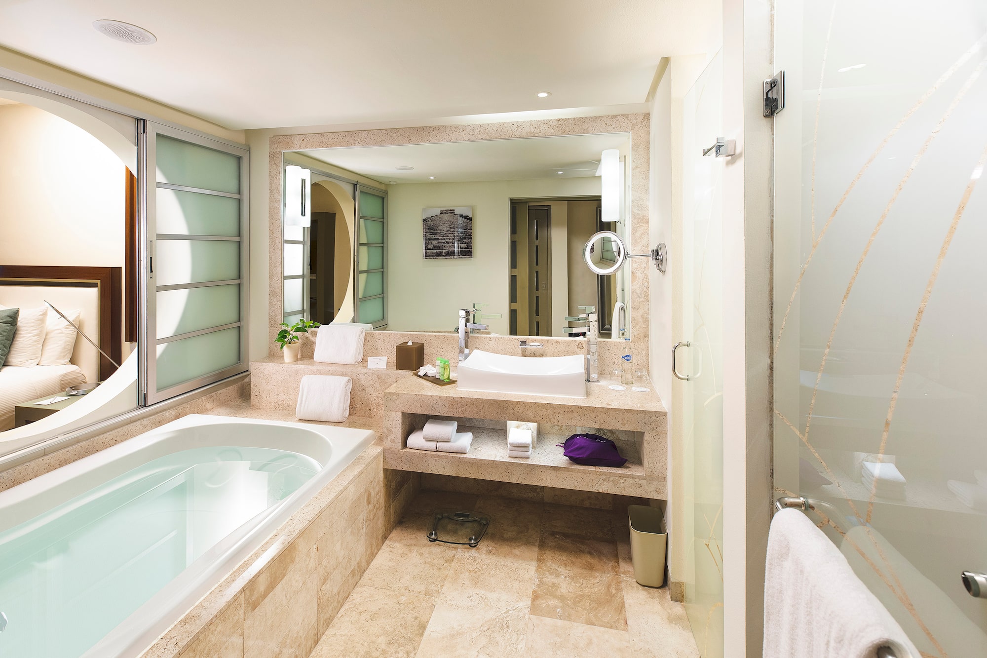 a bathroom with a bathtub and a mirror