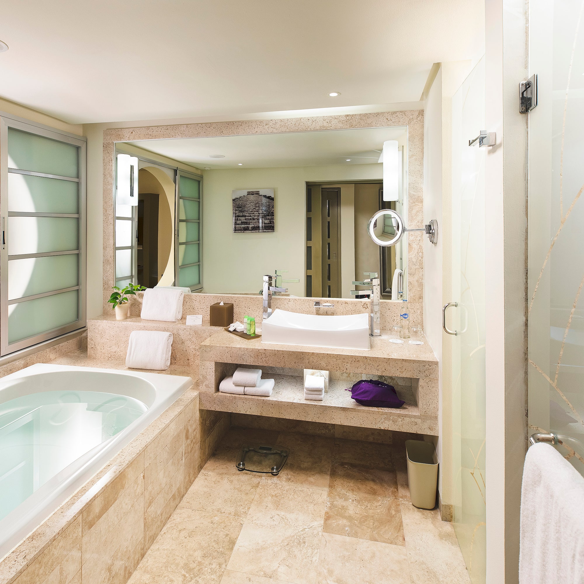 a bathroom with a bathtub and a mirror