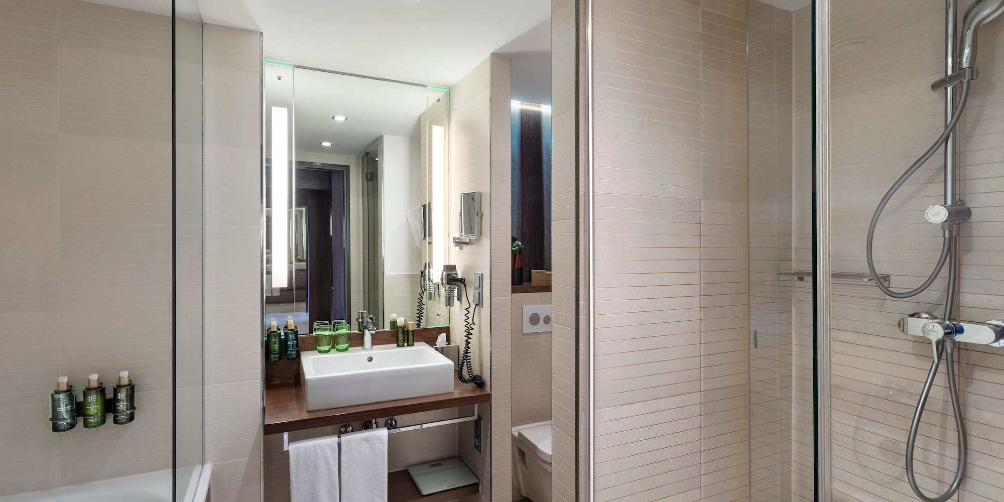 a bathroom with a sink and shower