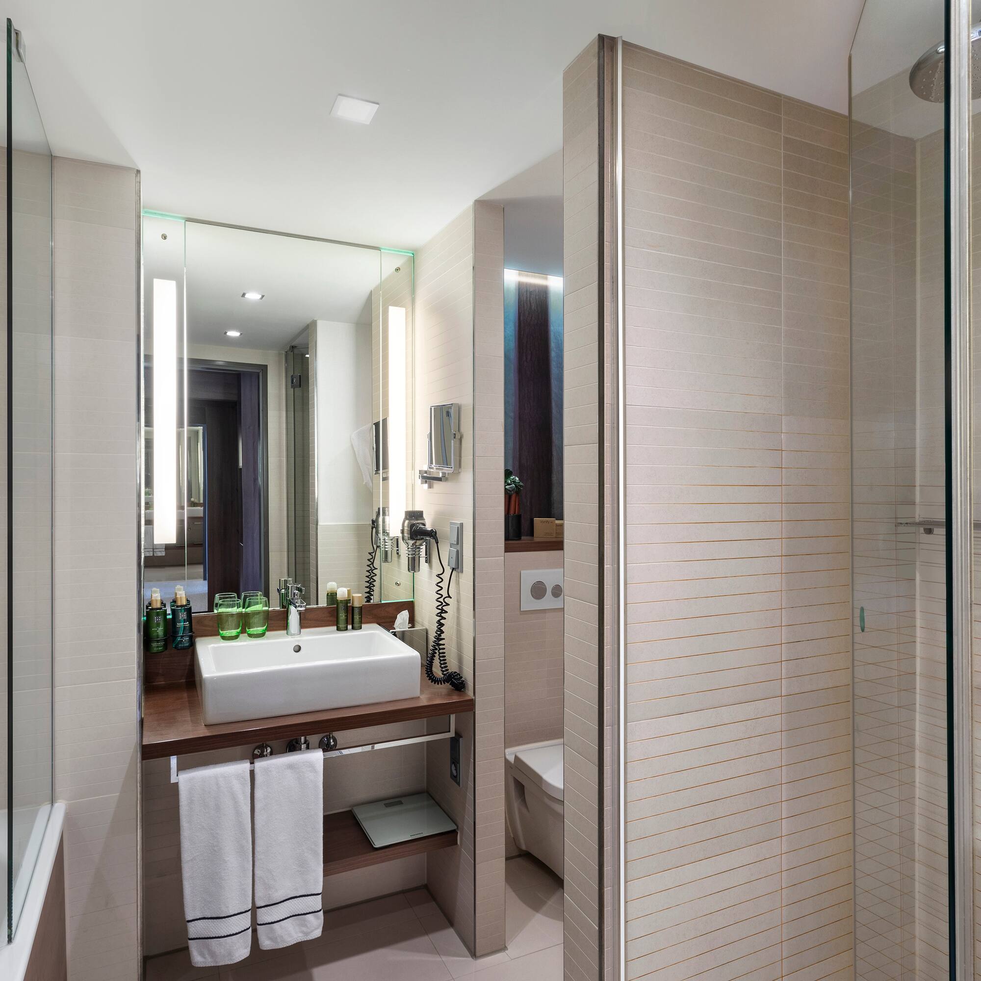 a bathroom with a sink and shower