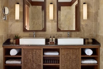 a bathroom with double sinks and mirrors