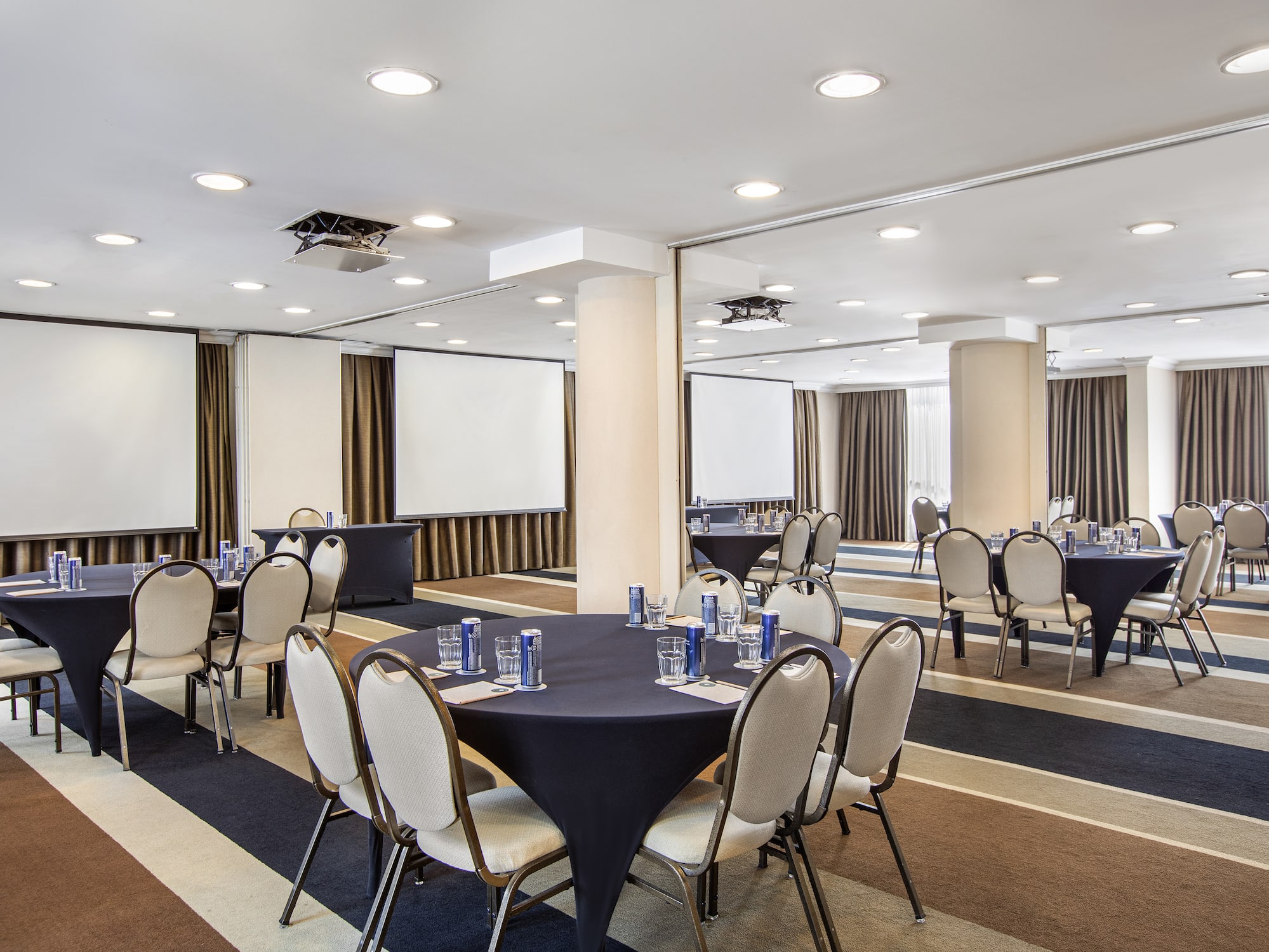 a room with a round table and chairs