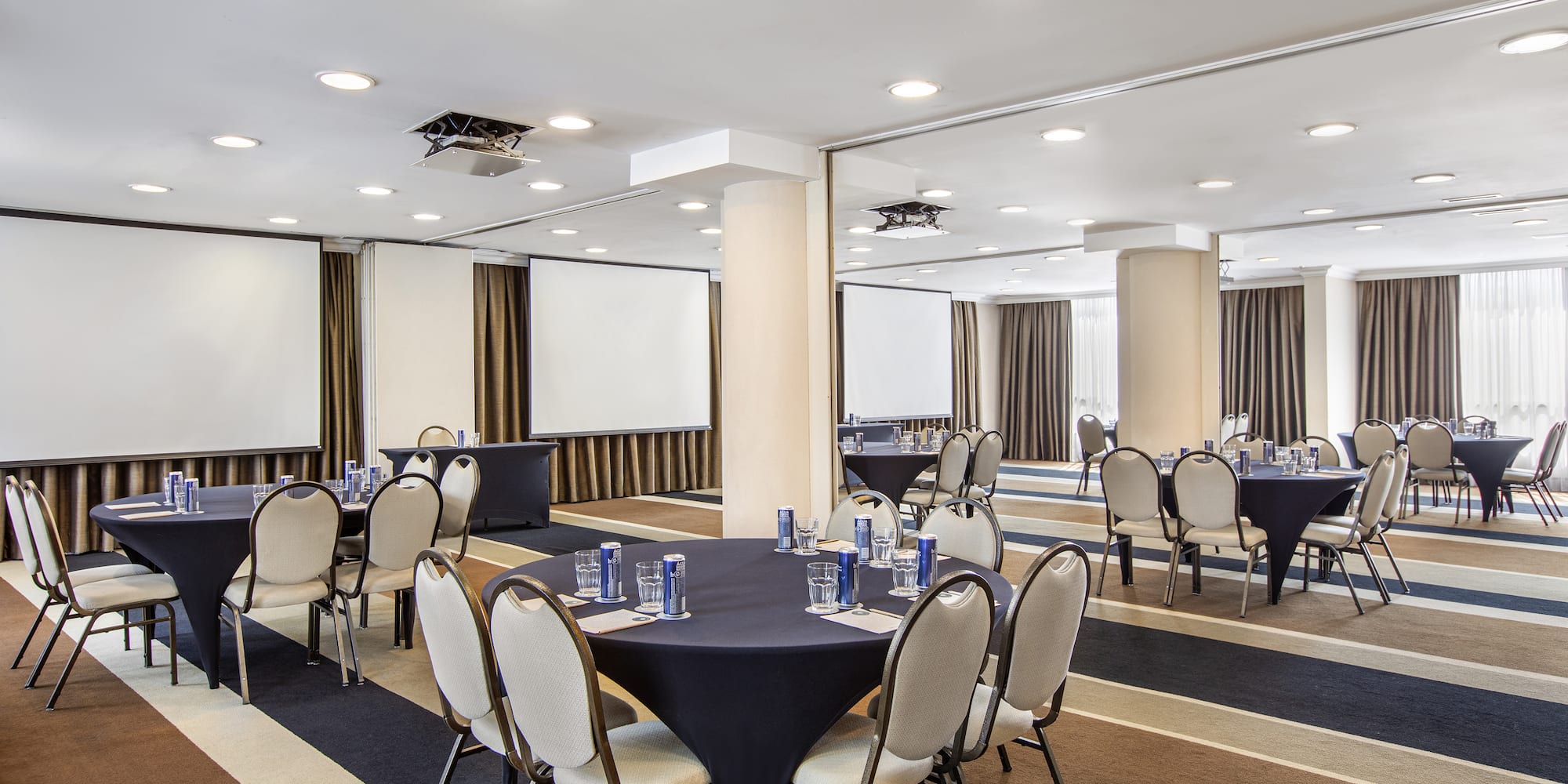 a room with a round table and chairs