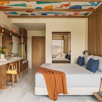 a bedroom with a bed and a sink