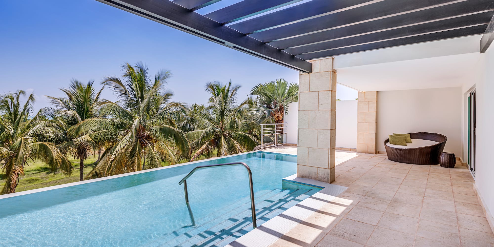 a pool with a deck and a chair