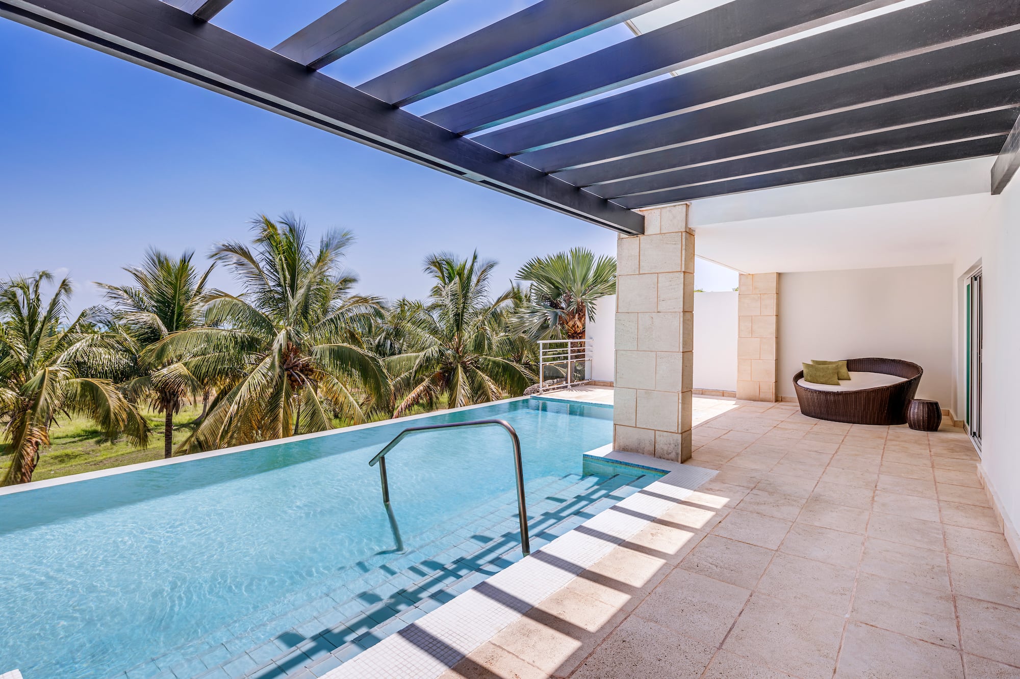 a pool with a deck and a chair