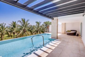 a pool with a deck and a chair