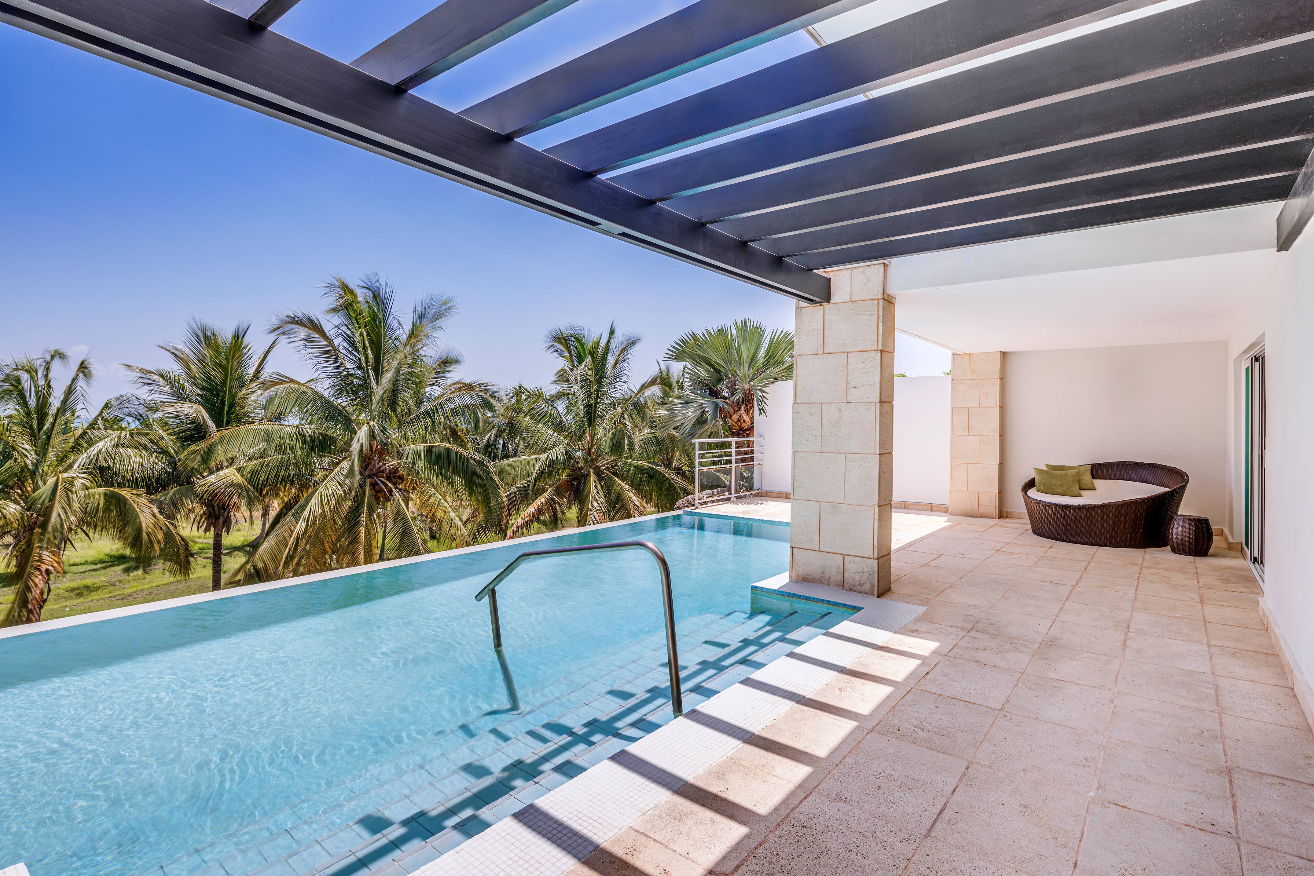 a pool with a deck and a chair