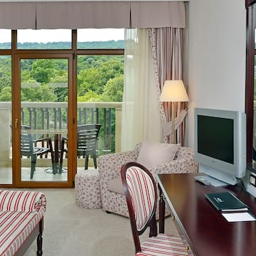 a living room with a television and a table