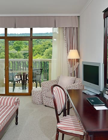 a living room with a television and a table