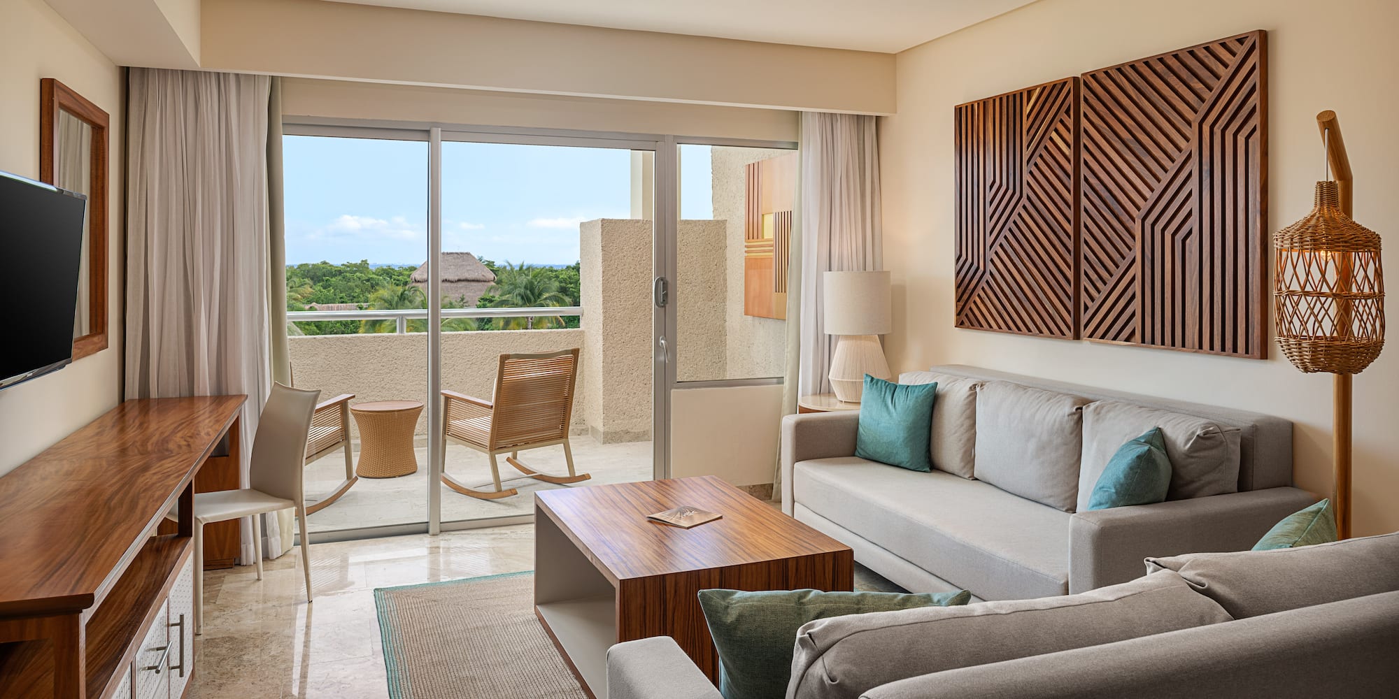 a living room with a glass door and a couch