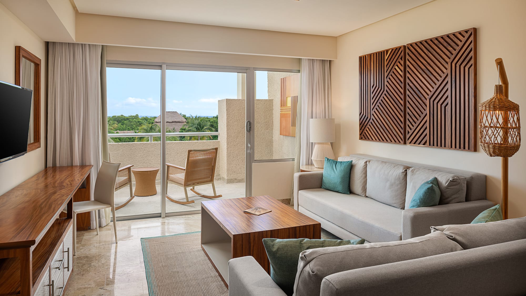 a living room with a glass door and a couch