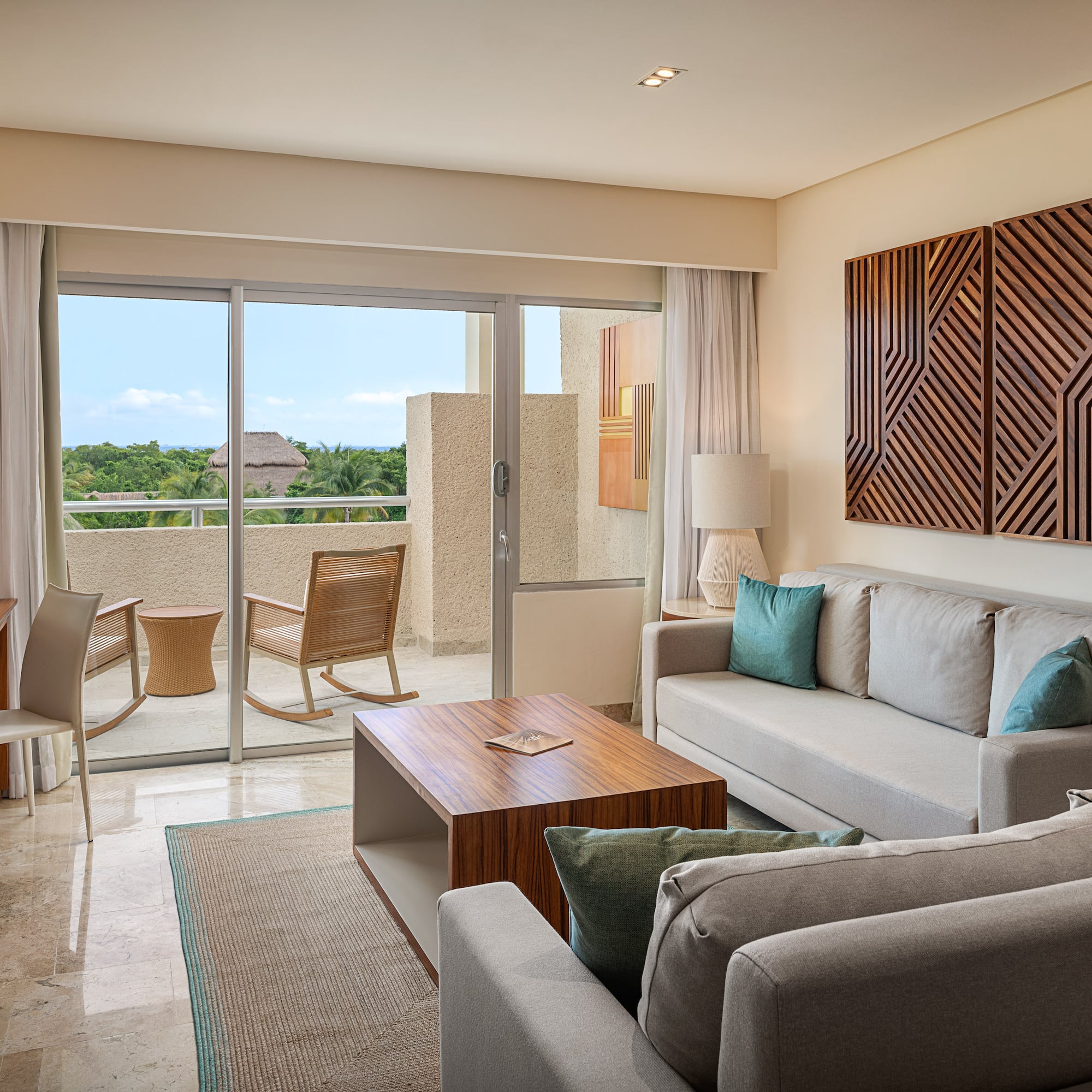 a living room with a glass door and a couch