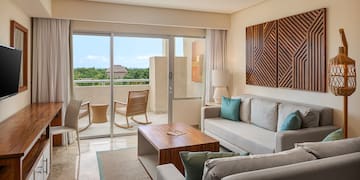 a living room with a glass door and a couch