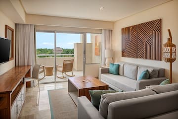 a living room with a glass door and a couch