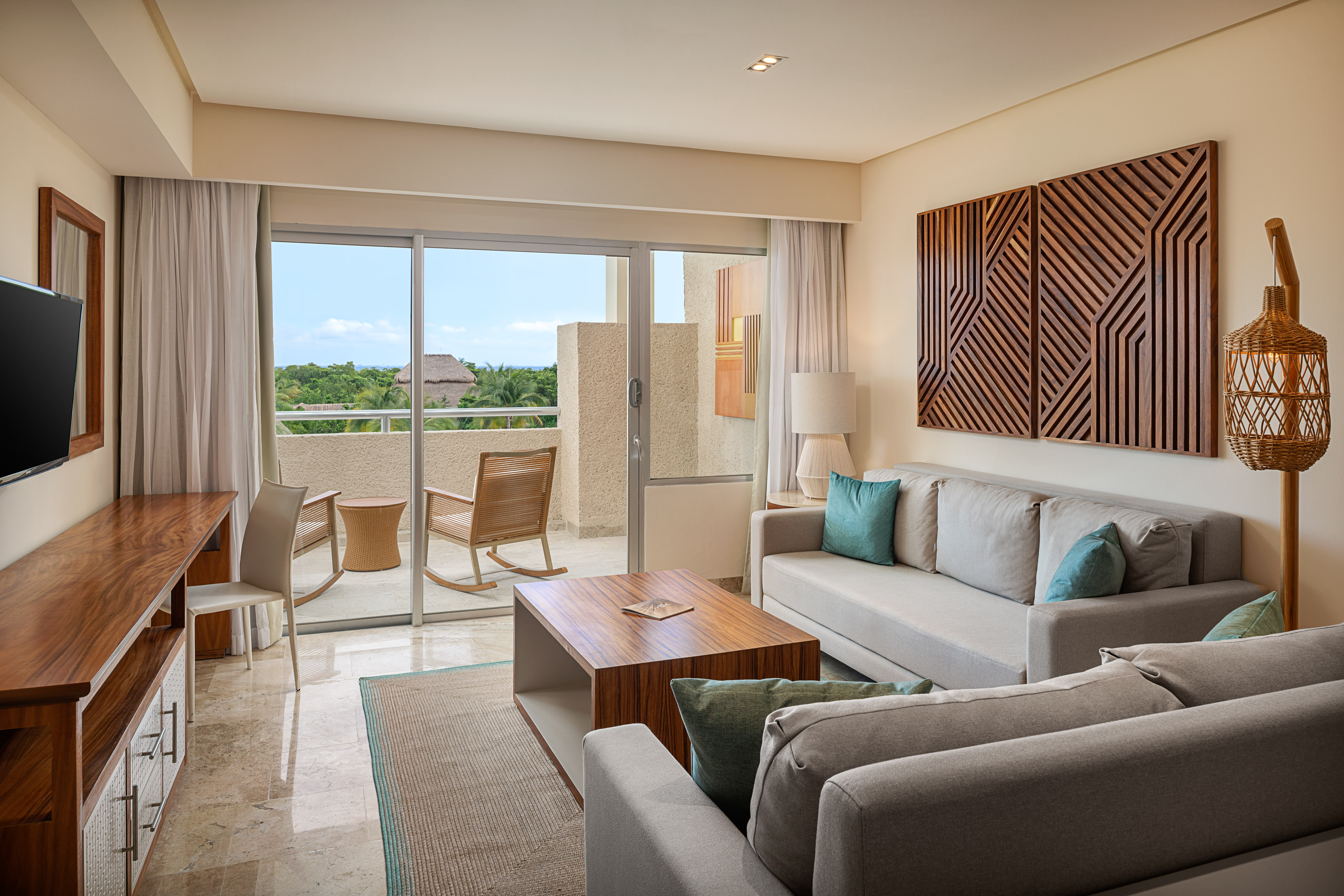 a living room with a glass door and a couch