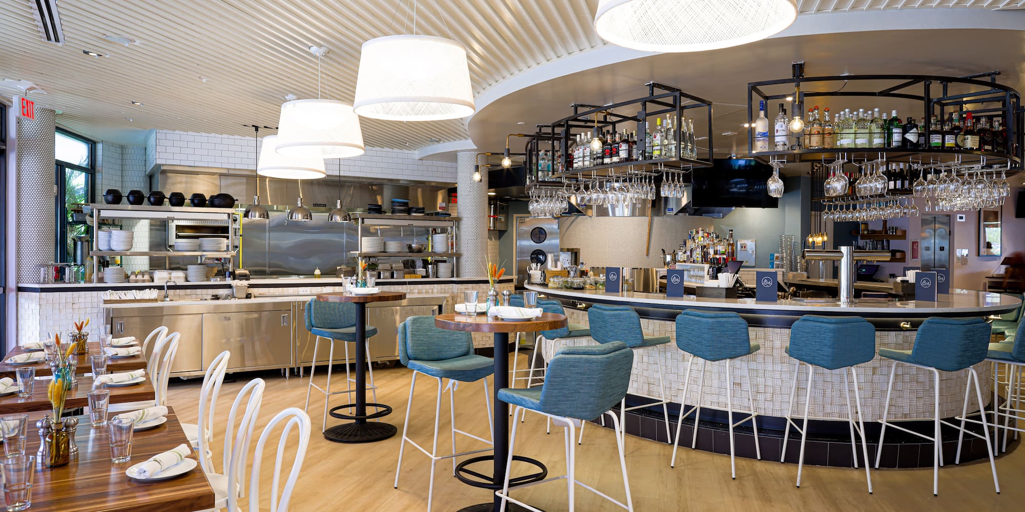 a restaurant with a bar and chairs