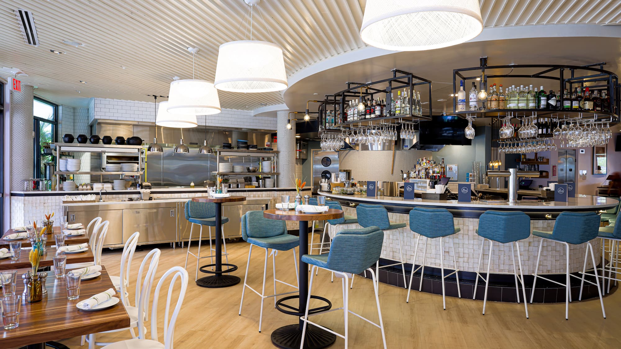 a restaurant with a bar and chairs