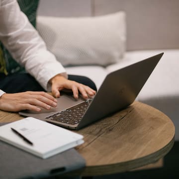 a person using a laptop on a table