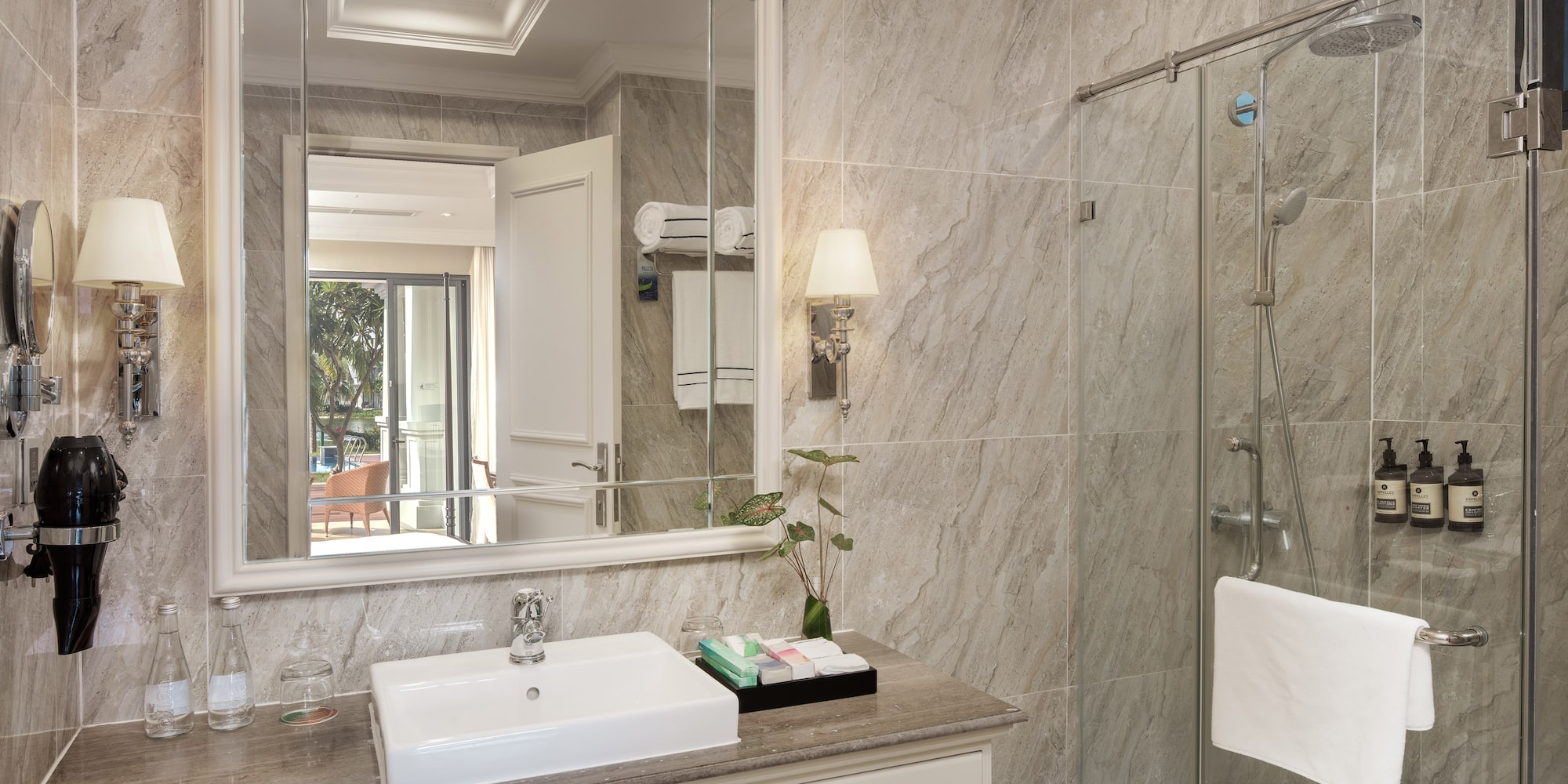 a bathroom with a mirror and sink