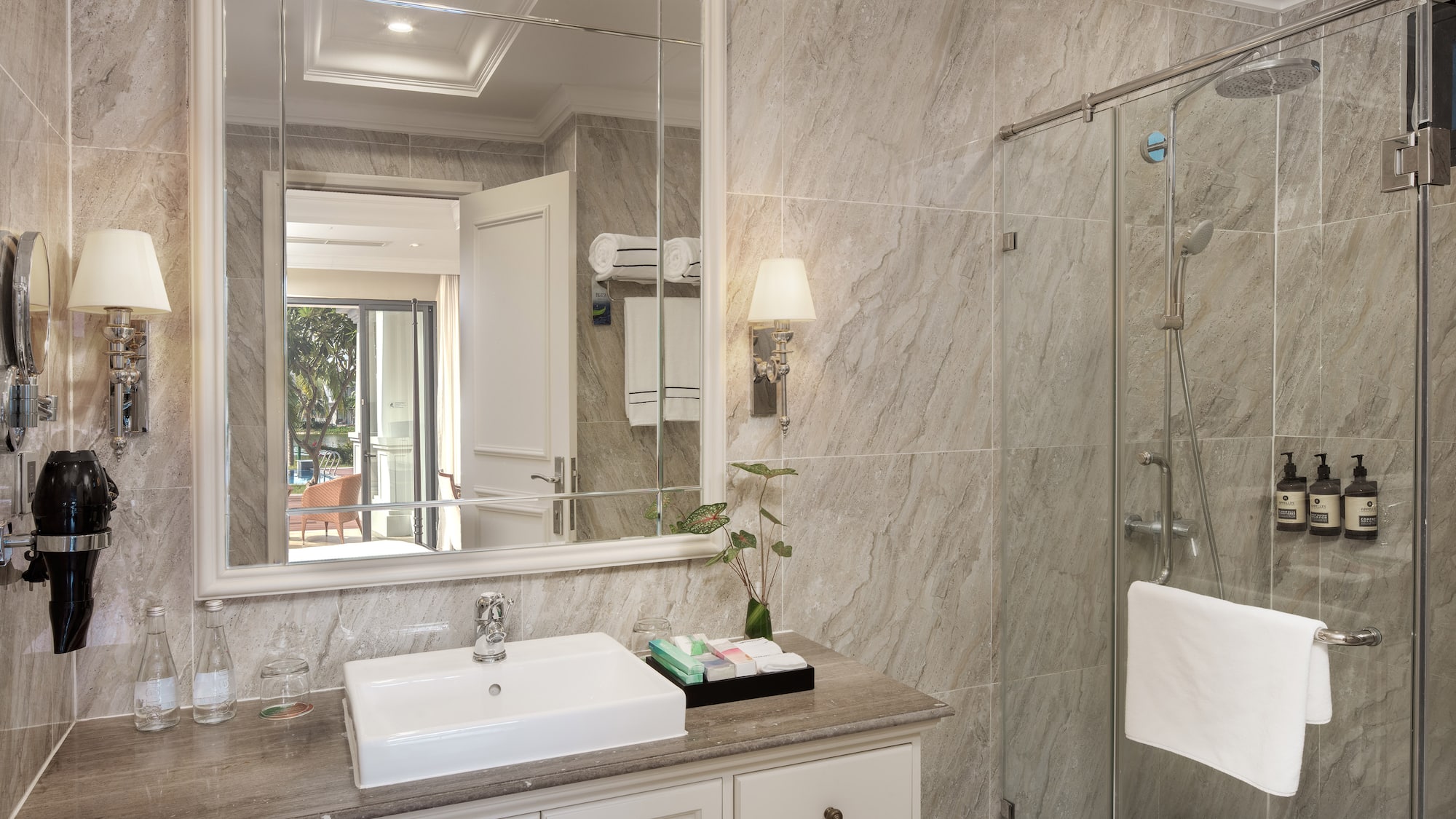 a bathroom with a mirror and sink