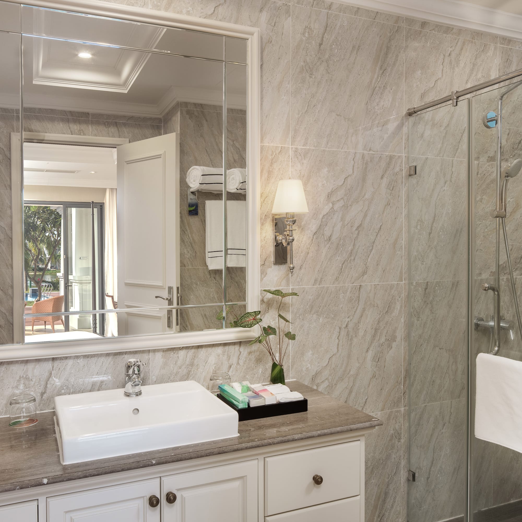 a bathroom with a mirror and sink