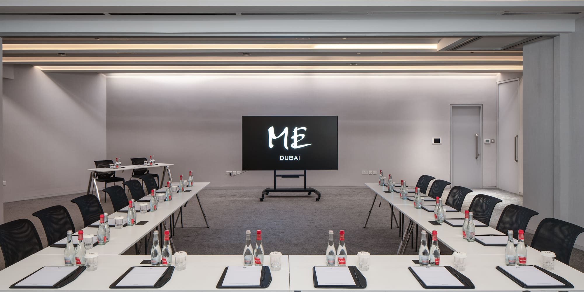 a room with tables and chairs