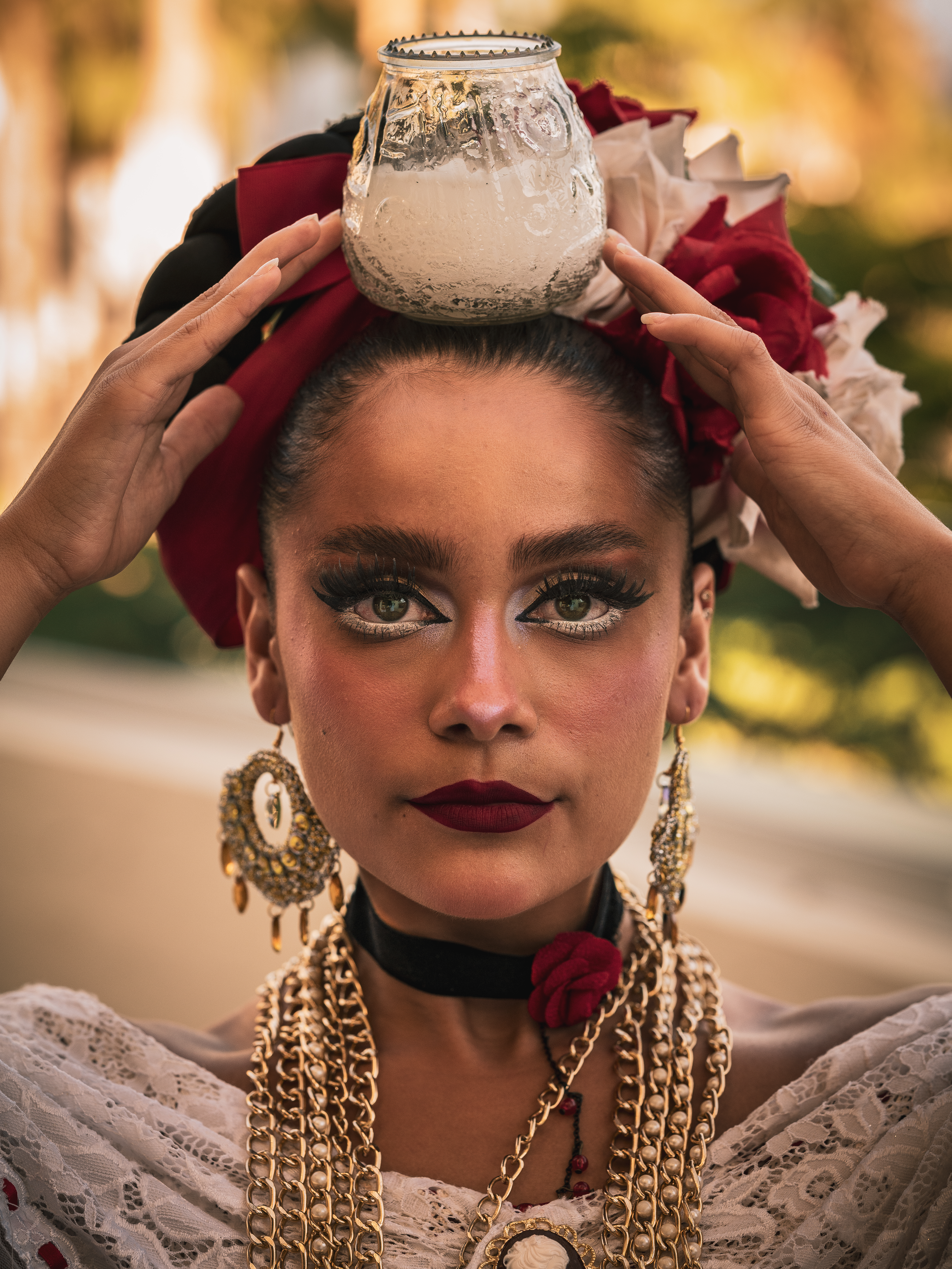 a woman with a vase on her head